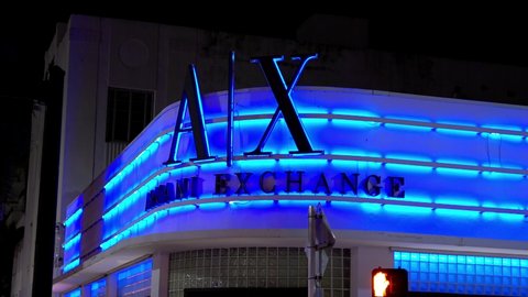 Colorful Armani Exchange store at South Beach Miami by night - MIAMI, USA - FEBRUARY 14, 2022