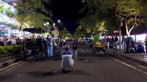 Jogjakarta, Indonesia - Dec 13, 2021: Established Shot of Malioboro Street in The Evening