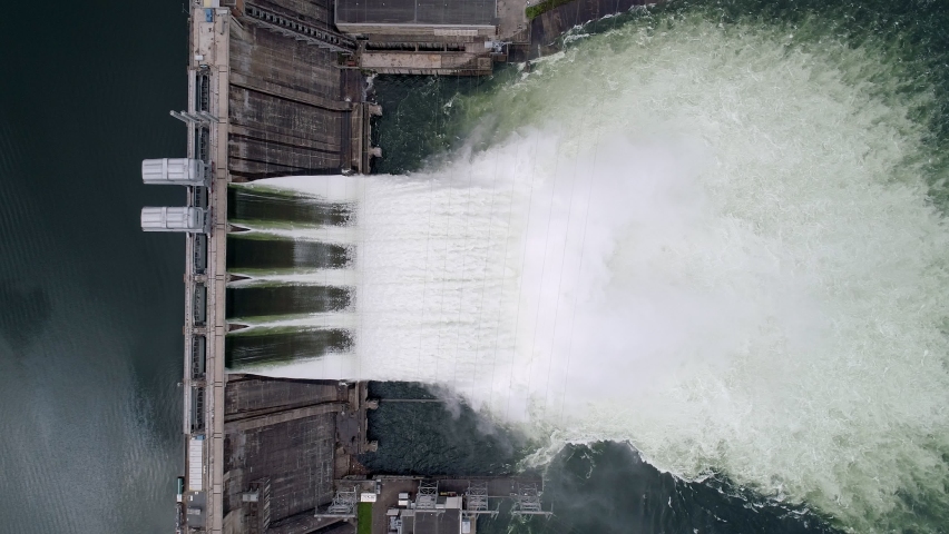 Aerial top down view of water discharge at hydroelectric power plant of Krasnoyarsk city, Siberia, Russia Royalty-Free Stock Footage #1088203915