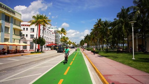 Miami Beach, FL, USA - March 12, 2022: Riding along Ocean Drive bike lane Spring Break 2022 4k 60fps