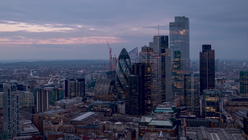 Day to night time lapse view of the City of London with the skyline and Tower Bridge in the background