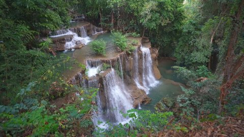 waterfall clear emerald water on summer season for holiday relax on green tree in jungle or natural forest at huai mae khamin waterfall floor 4 in KhuanSrinagarindra national park for nature landscape