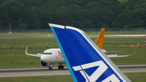 DUSSELDORF, GERMANY - JULY 22, 2017: Airbus A320-251N, TC-NBO of Pegasus slow down after landing at Dusseldorf airport (DUS)