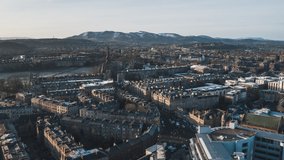 Establishing Aerial View Shot of Edinburgh UK, Scotland United Kingdom, old architecture and mountains