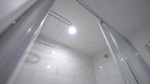 Modern bathroom, houses, a snapshot of the interior of real estate, home ownership. Bathroom design with shower. The interior of the apartment has a shower and toilet.