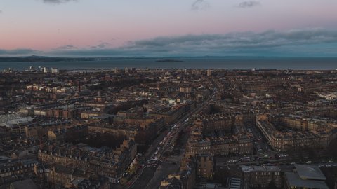 Establishing Aerial View Shot of Edinburgh UK, Scotland United Kingdom, just after sunset, last light