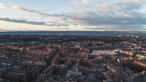 Establishing Aerial View Shot of Edinburgh UK, Scotland United Kingdom, superwide citryscape witrh sea view