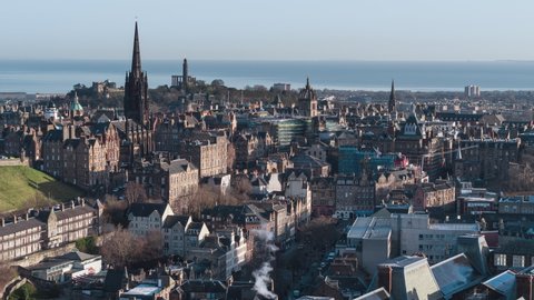 Establishing Aerial View Shot of Edinburgh UK, Scotland United Kingdom, old town churches, day