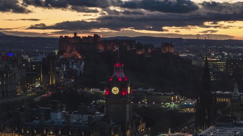 Establishing Aerial View Shot of Edinburgh UK, Scotland United Kingdom, lights on the landmarks, Edinburgh Castle