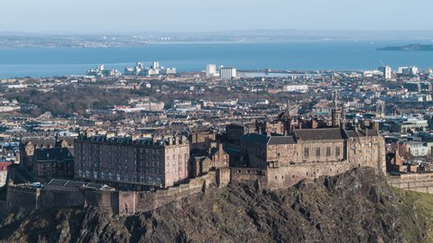 Establishing Aerial View Shot of Edinburgh UK, Scotland United Kingdom, day Edinburgh Castle, paralaxe shot