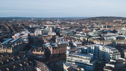 Establishing Aerial View Shot of Edinburgh UK, Scotland United Kingdom, tightly set buildings in center