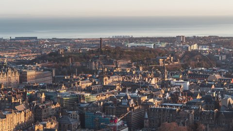 Establishing Aerial View Shot of Edinburgh UK, Scotland United Kingdom, old town and Calton Hill