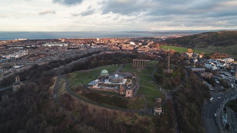 Establishing Aerial View Shot of Edinburgh UK, Scotland United Kingdom, Calton Hill in mixed light