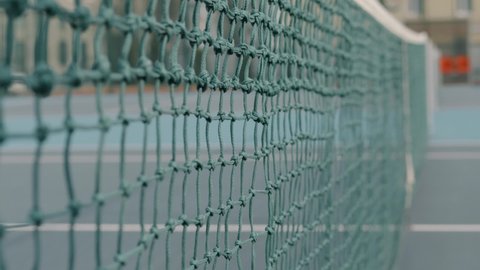 Tennis ball hit the net after being hit in slow motion