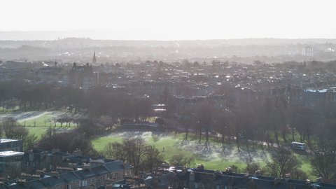 Establishing Aerial View Shot of Edinburgh UK, Scotland United Kingdom, sun kissing the city