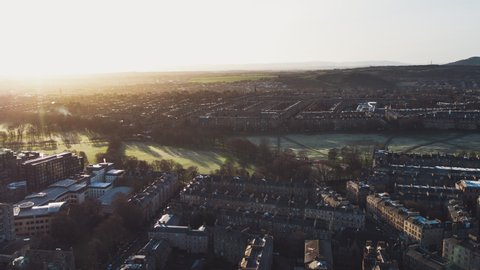 Establishing Aerial View Shot of Edinburgh UK, Scotland United Kingdom, sun shining over town