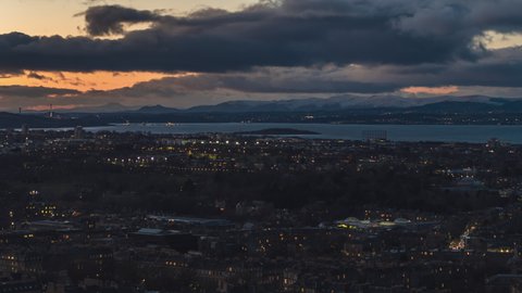 Establishing Aerial View Shot of Edinburgh UK, Scotland United Kingdom, early evening over vast northern city