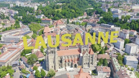 Inscription on video. Lausanne, Switzerland. Cathedral of Lausanne. La Cite is a district historical centre. Knitted texture inscription, Aerial View, Point of interest
