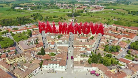 Inscription on video. Palmanova, Udine, Italy. An exemplary fortification project of its time was laid down in 1593. Flames with dark fire, Aerial View