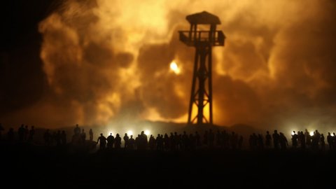 Creative artwork decoration - Russian war in Ukraine concept. Crowd looking on giant explosion and giant watchtower. Selective focus