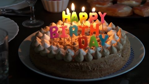 Birthday cake. Candles on a cake. Burning candle. Happy birthday pie. Light and extinguish the candles on the cake.