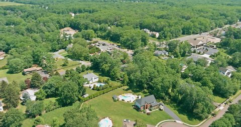 Aerial top panorama view residential neighborhood apartment complex, in American town, on between forest landscape in Monroe New Jersey US