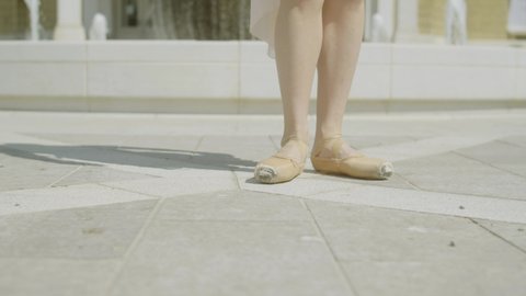 Rijeka , Croatia - 03 09 2022: Close shot of ballerina legs and shoes dancing in a slow motion, 4K footage in Rijeka, Croatia