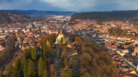 aerial view of historic medieval town of Sighisoara, famous tourist destination in Romania, scenic unesco heritage site in Transylvania in winter. High quality 4k footage