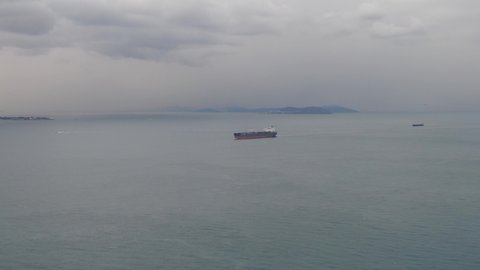 Aerial footage of ultra large container ship at sea, top down view  