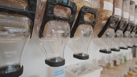 Biodegradable vegan shop for buying eco bio goods glass jar pack on shelf. Trendy living life in SME startup store go green market refill bulk shop for reduce climate change net zero free concept.