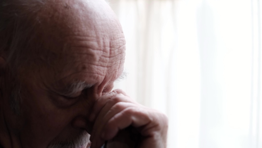 The old bald man has a headache, he is in despair and depression | Shutterstock HD Video #1088230389