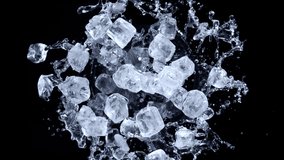 Super slow motion shot of rotating exploded Ice Cubes and splashing water on black at 1000fps. - Powered by Shutterstock - Get 15% off with code: PIKWIZARD15