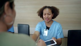 People making an appointment with medical staffs at reception desk in hospital. Medical staff and nurse - receptionist talking to patient in front of the reception counter in hospital. - Powered by Shutterstock - Get 15% off with code: PIKWIZARD15