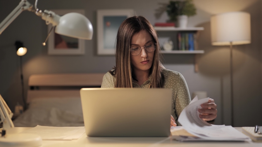 Crash at work. Overworked remote worker in home office tries to find right document as more pages fall from above. Overworked employee gets an extra task Royalty-Free Stock Footage #1088233743