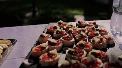 red caviar canape on the festive table of appetizers	
