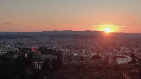 Aerial drone distant sunset view of Florence Cathedral, Cattedrale di Santa Maria del Fiore and panoramic view of Florence city Tuscany region of Italy Florence 
