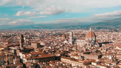 Aerial drone view of Florence Cathedral, Cattedrale di Santa Maria del Fiore, Ponte Vecchio and The Arno River, Tuscany region of Italy Florence 