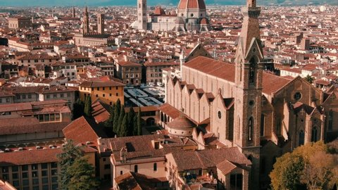 Aerial drone view of Florence Cathedral, Cattedrale di Santa Maria del Fiore, Ponte Vecchio and The Arno River, Tuscany region of Italy Florence 
