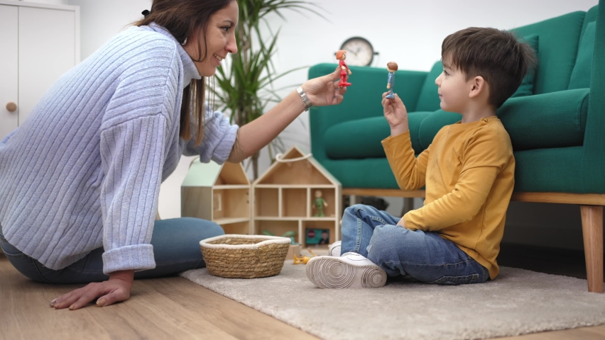 Educational Therapist playing game with little child with wooden toy to help him to improve his behavior and mental health Royalty-Free Stock Footage #1088240259