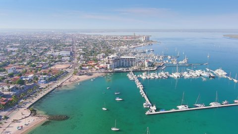 La Paz, Mexico: Aerial view of capital city of Baja California Sur, clear turquoise waters of Gulf of California, ships and boats in Marina La Paz, sunny day with blue sky - landscape panorama
