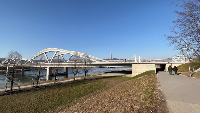 Linz danube river with arced bridge