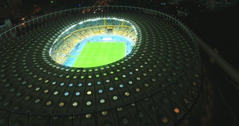 Night Football Stadium in Kiev, Ukraine. October 9, 2017. World Cup. Ukraine-Croatia. cityscape time of day night. The view from the top to the illuminated stadium with games and fans.