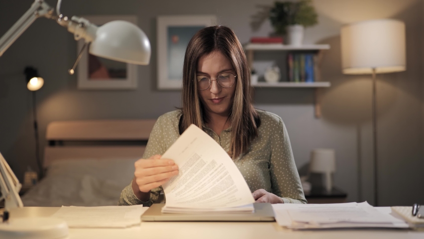 Overworked freelancer at work. Irritated woman cannot find right document. Remote worker at home office trying to deal with lot of paperwork Royalty-Free Stock Footage #1088249353