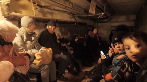 Ukraine. Kharkov. March 1, 2022: Ukraine War. People hiding in shelter in the basement. Russian aggression. Victims of Russian military aggression