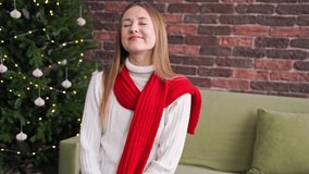 Young woman posing indoors. Home vacation portrait. Blogger selfie video. Alone in interior. Happy emotion. Smiling female person. Lifestyle action. Christmas background
