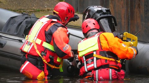 Norwich, Norfolk, United Kingdom. February 19, 2021. Norfolk Fire and Rescue Service Urban Search and Rescue surface rescue boat crew attend outboard engine.