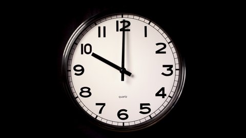 An unbranded modern clock in timelapse covering 2 hours up to 12 o clock