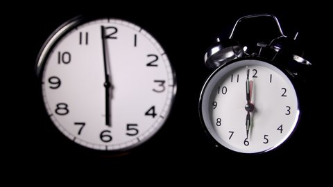 ZOOM IN - One modern and one traditional alarm clock covering 6 hours up to 12 o clock