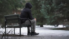 Man sitting on a bench and feeling lonely and depressed - Powered by Shutterstock - Get 15% off with code: PIKWIZARD15