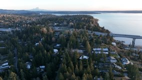 Cinematic 4K aerial drone trucking shot of Bellevue, Medina, Hunts Point, Yarrow Point, Clyde Hill, Evergreen Pt floating bridge, Lake Washington mansions, luxury homes, villas